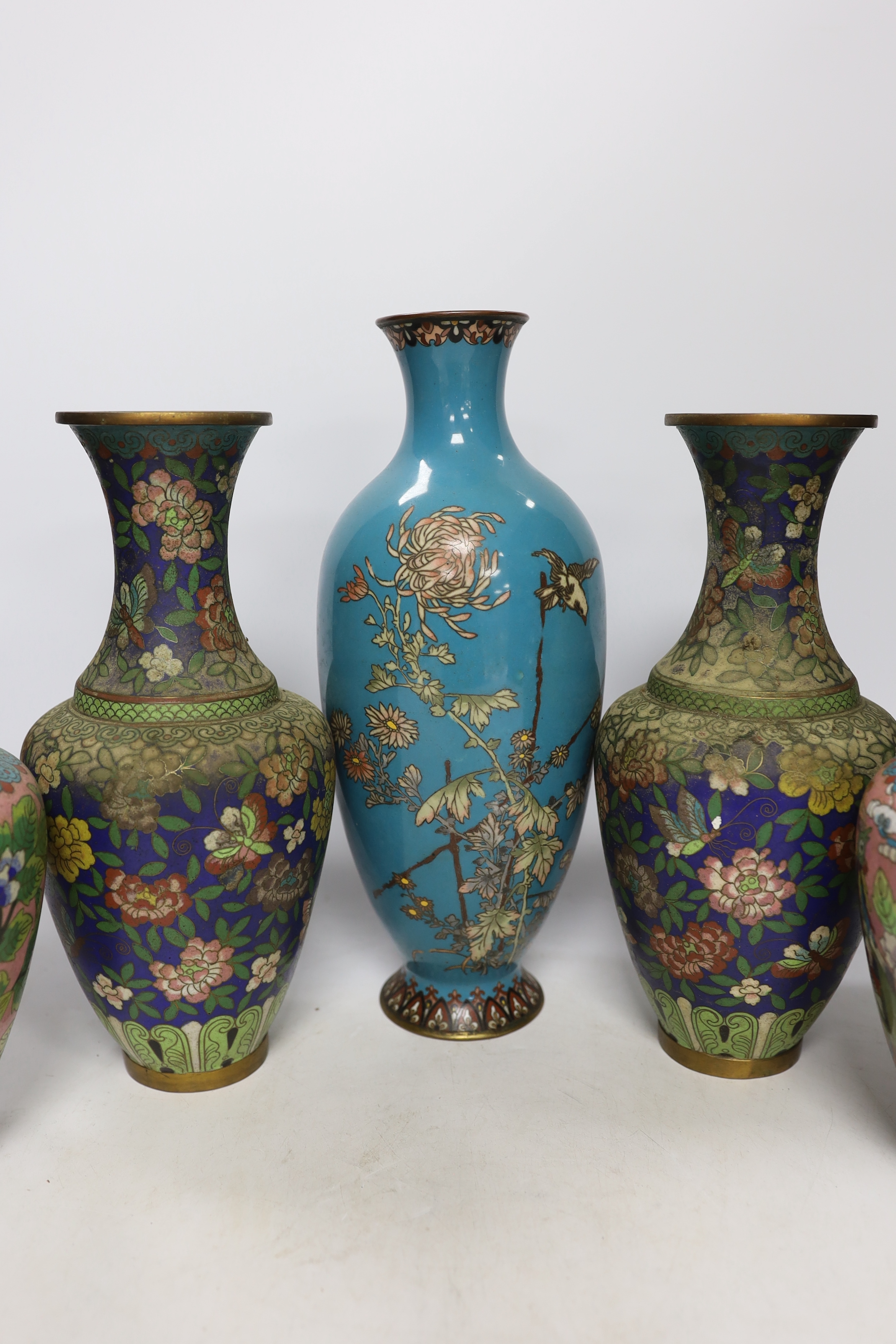 Two pairs of Chinese cloisonné enamel vases and a Japanese turquoise ground vase, 30cm high (5)